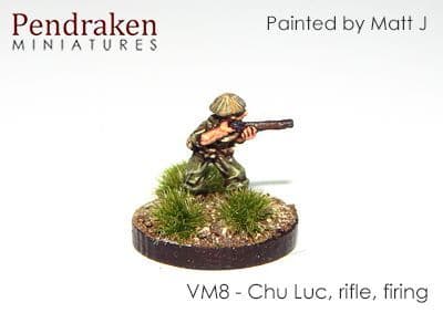 Chu Luc with rifle, firing