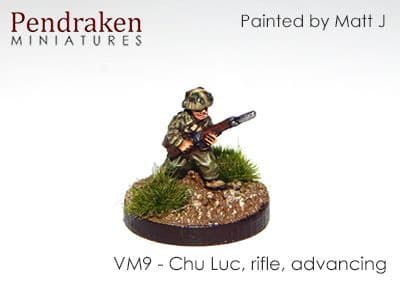 Chu Luc with rifle, advancing